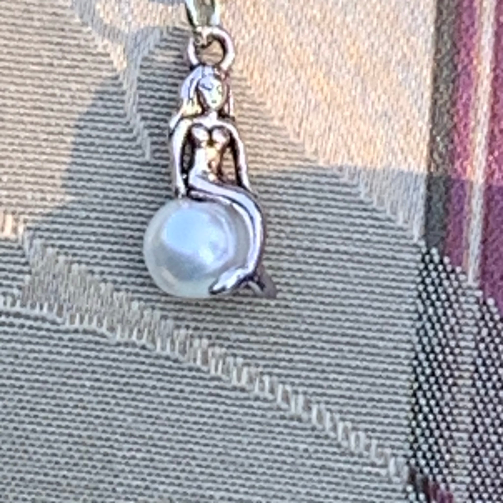 Mermaid Sunning on a Pearl Necklace