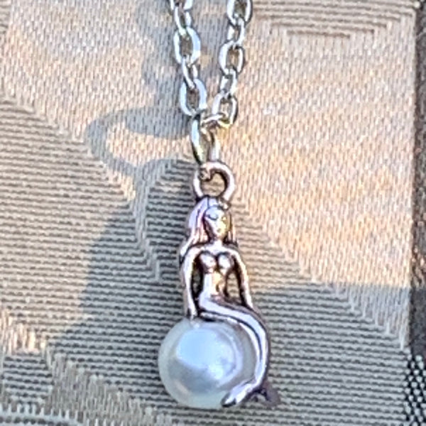 Mermaid Sunning on a Pearl Necklace